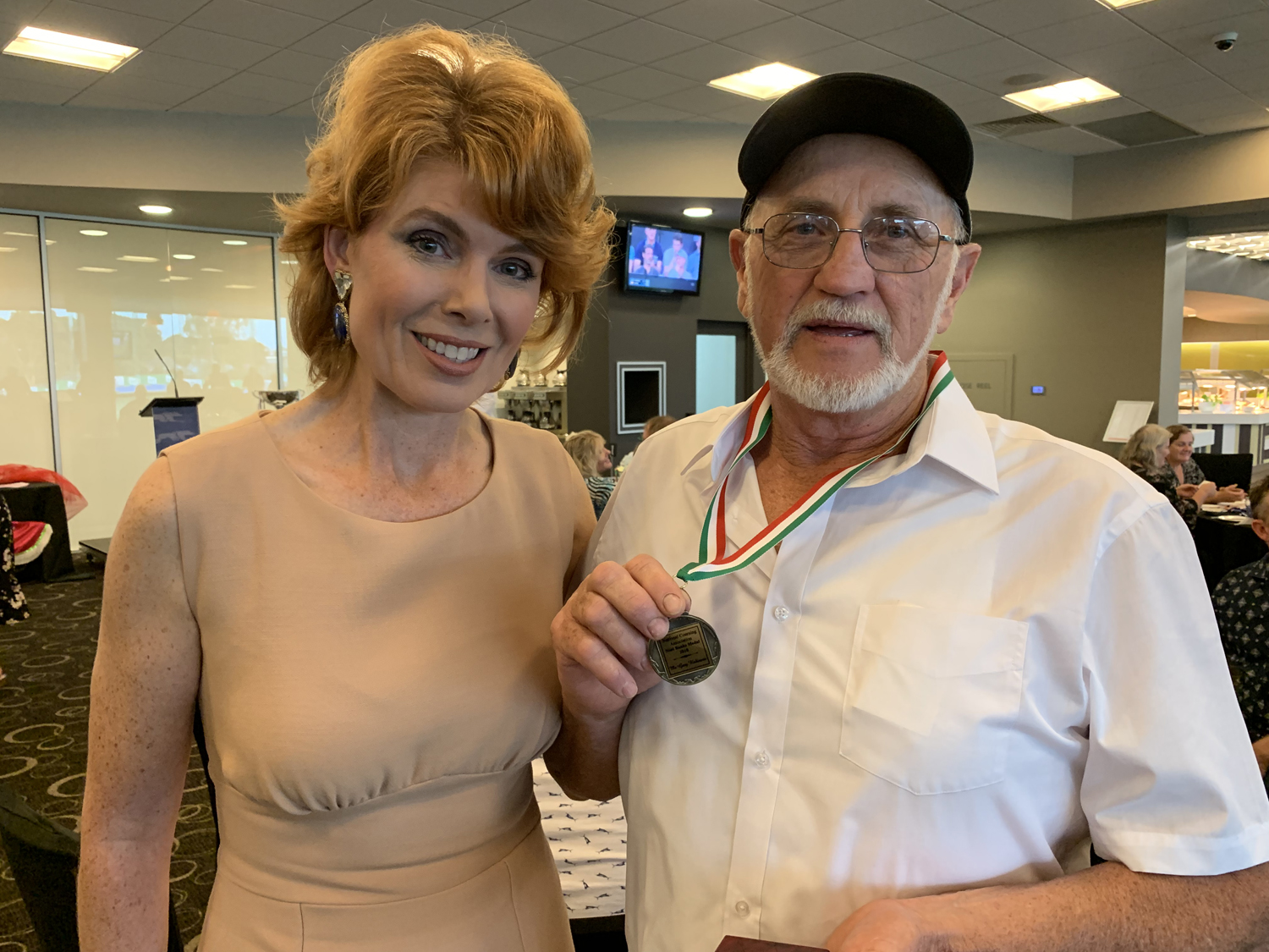 2018 Noel Banks Medallist Gary Robinson with race caller Victoria Shaw.